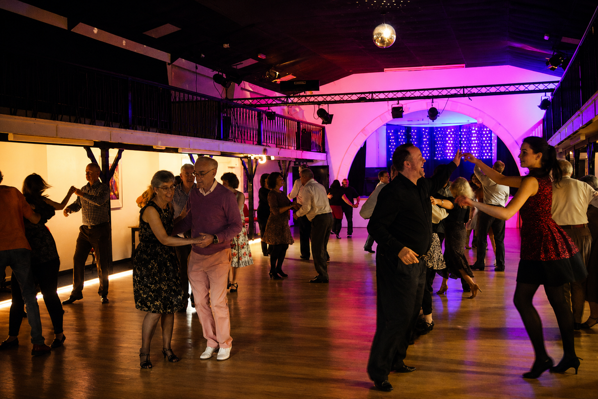 Adults dancing together at an Aspirations Dance social